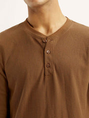 Levi's men's solid henley neck t-shirt, close-up detail showing soft fabric and classic design, in a neutral color.