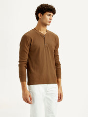 Levi's men's solid henley neck T-shirt in a side view, showcasing the casual fit and classic design.
