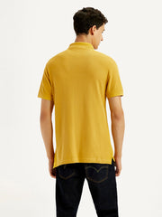 Back view of Levi's men's solid yellow slim fit polo T-shirt, long sleeve design, casual upper clothing for men.