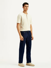 Levi's men's regular fit blue jeans shown from the side, classic denim style, with visible stitching and belt loops.
