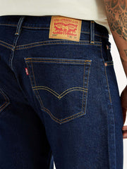 Levi's men's 505 dark blue straight fit mid-rise jeans with detailed stitching and classic denim texture.