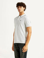 Levi's men's solid light-grey slim fit polo T-shirt shown from side view, casual upper wear with short sleeves and collar.