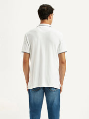 Back view of Levis men's solid white slim fit polo t-shirt, showcasing fabric texture and tailored design.