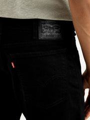 Close-up of Levi's men's jeans showing detailed stitching and fabric texture from front view.