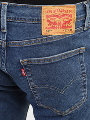 Back view of Levi's men's 511 blue slim fit mid-rise jeans showing back pockets and stitching details.
