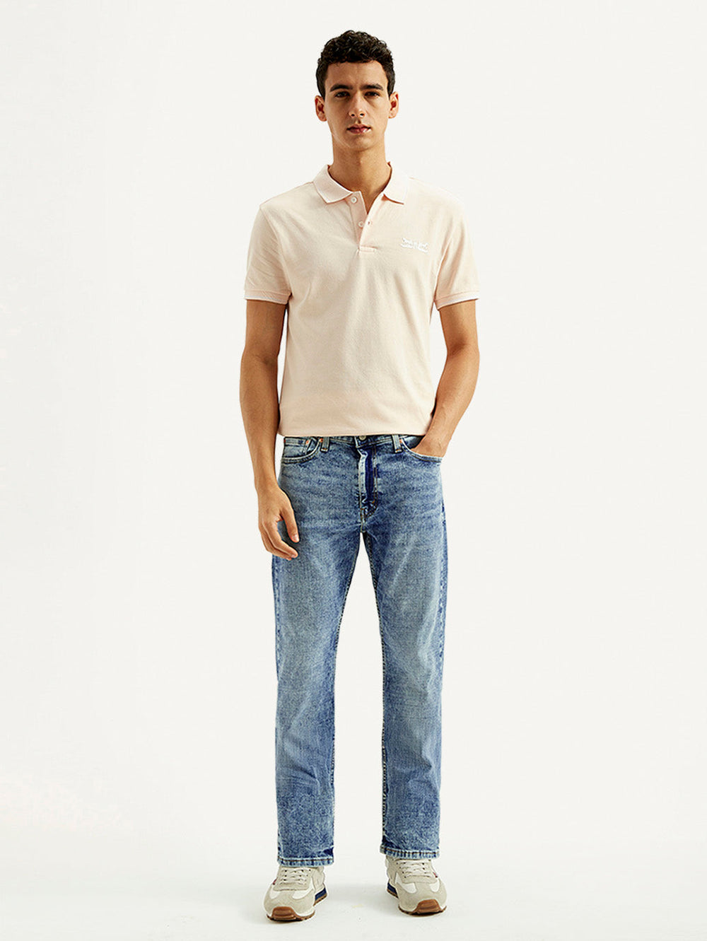 Levi's men's jeans 23677-0390 in classic blue denim, front view showing slim fit and traditional five-pocket design.