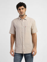 Levi's men's solid slim fit linen casual shirt, front view showing collar and button closure, lightweight breathable fabric.
