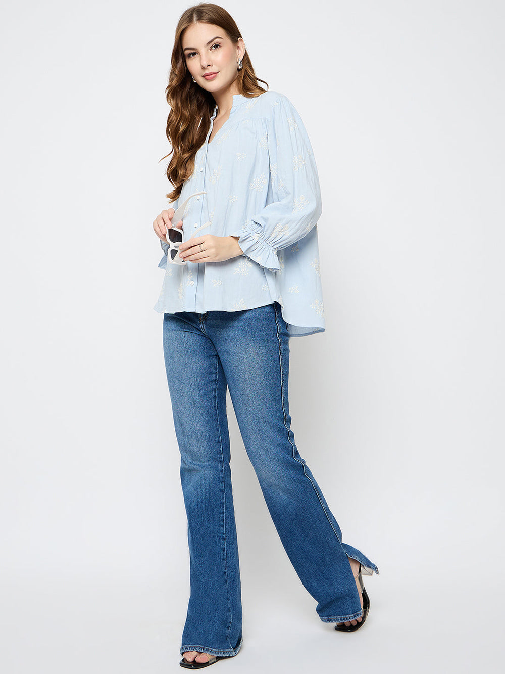 Powder blue Madame Ladies Western top, short-sleeve, fitted style with Western-inspired design, displayed on a hanger.