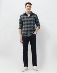 Navy U.S. Polo men's casual shirt displayed on a hanger, featuring a classic design and soft fabric for everyday wear.