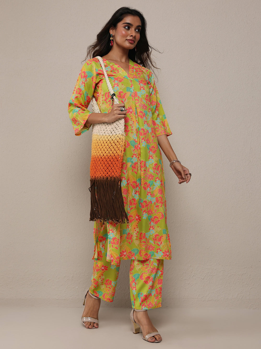 Green printed rayon co-ord set for ladies featuring a kurti and matching pants from Libas, stylish western wear ensemble.
