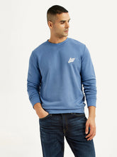 Men's Levi's blue crew neck sweatshirt with brand logo, showcasing a comfortable pullover style ideal for winter wear.