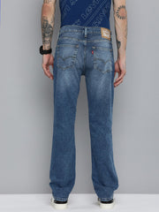 Levi's men's 511 blue slim fit mid-rise jeans, shown on a model, featuring classic five-pocket design and casual style.