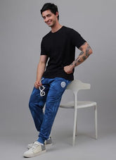 Blue Marvel Captain America joggers for men with graphic print, regular fit, made by Bio World, designed for sportswear comfort.