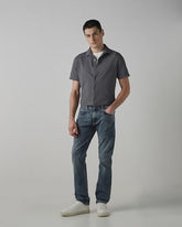 Mufti men's straight-leg jeans in medium wash faded denim with five-pocket style, cotton blend and stretch fabric for casual wear.