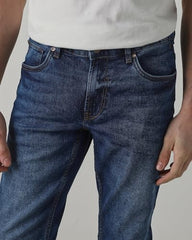 Mufti men's super slim fit mid-rise jeans in medium indigo blue denim with five-pocket style and stretch fabric, size 32.