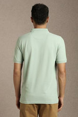 Men Green Solid Polo Neck T-Shirt
