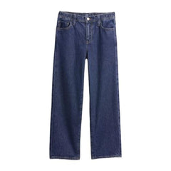 Boy wearing dark blue Gap relaxed heavy-wash jeans for boys size 10 years, showing front view with pockets and belt loops.
