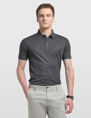 Arrow men's solid regular fit polo shirt in a classic design, shown on a hanger with a collared neckline.