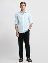 Arrow Sport men's sage and sun Chelsea slim fit casual shirt, long sleeve, button-up with collar, on a hanger.