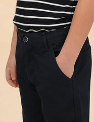 U.S. Polo boys navy cargo pants for kids, featuring multiple pockets and a comfortable fit, displayed on a hanger.