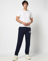 Navy blue Gap men's regular fit mid-rise joggers with elastic waistband and drawstrings, made from comfortable sportswear fabric.