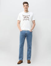 U.S. Polo Assn. Denim Co. men's ivory long sleeve T-shirt with graphic brand print, casual style, and comfortable fit.