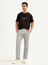 Men's grey slim fit chinos by Levi's, showing the tailored fit and classic style in a casual men's lower jeans product image.