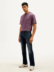 Levis men's jeans A6634-0044, side view showing classic denim fit and detailed stitching on the blue denim jeans.