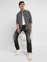 Levis men's jeans A7710-0019 in classic denim, shown in a style shot highlighting fit and stitching details.