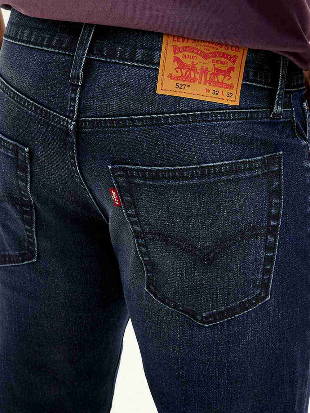 Levi's men's jeans in classic blue denim, detailed close-up showing stitching and fabric texture.