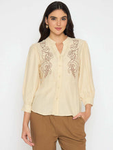 Beige Madame Ladies Western top with long sleeves and a fitted design, displayed on a plain background.