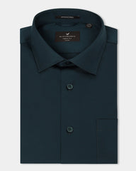 Blackberry men's teal non-iron solid formal shirt, Sylvia model, displayed on a hanger with a crisp collar and smooth fabric.