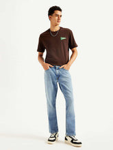 Levi's men's 541 blue athletic tapered fit mid-rise jeans, front view showing classic denim with subtle fading and stitching details.