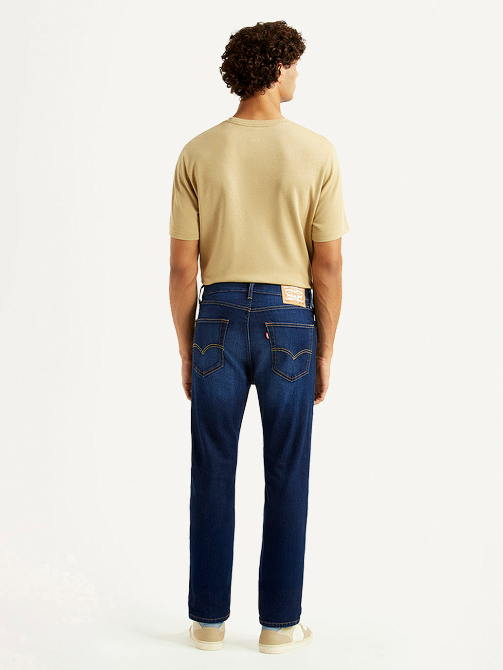 Levi's men's 505 navy straight fit mid-rise jeans shown from the back with classic denim style and stitching details.