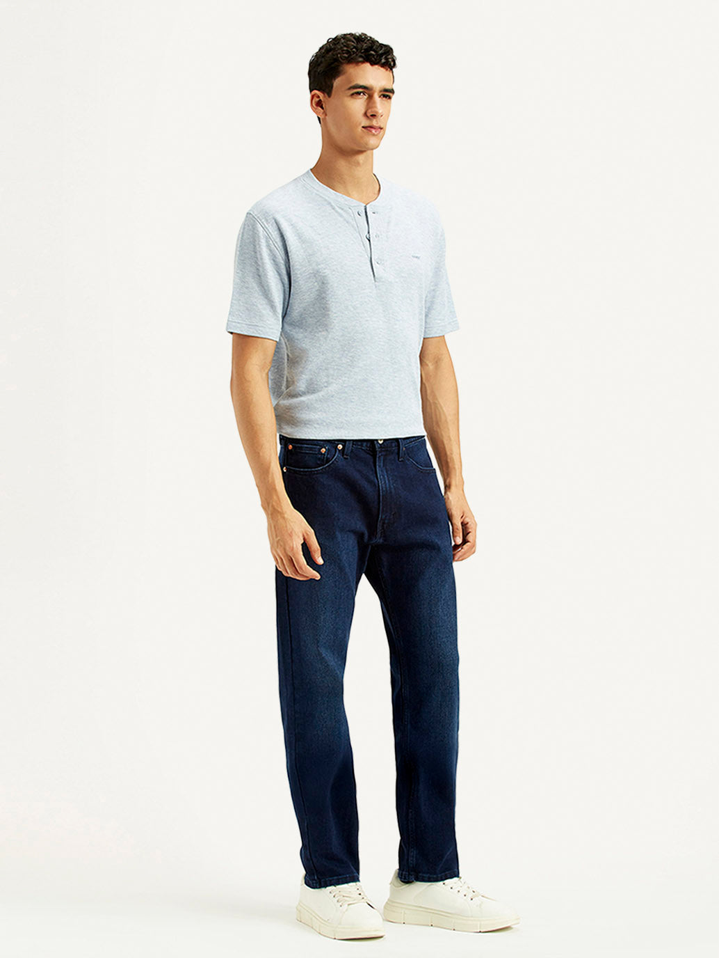 Levis men's jeans 001H9-0122 shown from the side, featuring classic denim fabric and a slim fit design.