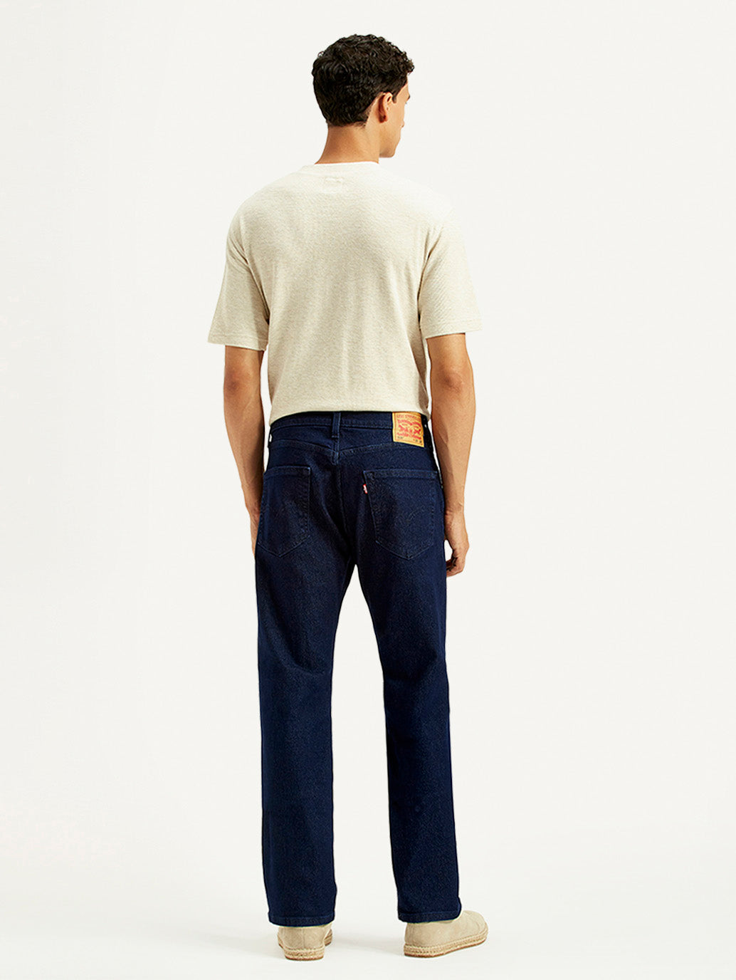 Levi's men's regular fit blue jeans shown from the back, featuring classic five-pocket design and leather logo patch.