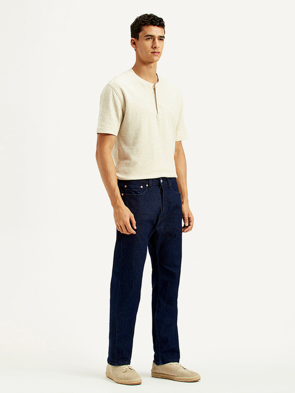 Levi's men's regular fit blue jeans shown from the side, classic denim style, with visible stitching and belt loops.
