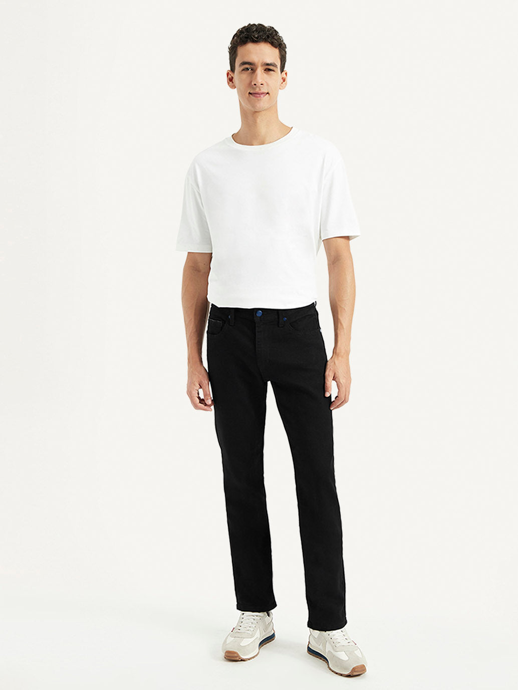 Levi's men's 511 black slim fit mid-rise jeans, front view showing classic five-pocket design and modern fit.