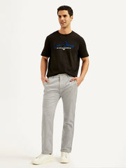 Men's grey slim fit chinos by Levi's, showing the front view with classic five-pocket styling and slim cut fit.