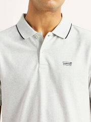 Levi's men's light-grey slim fit polo T-shirt with a collar and short sleeves, displayed on a plain background.