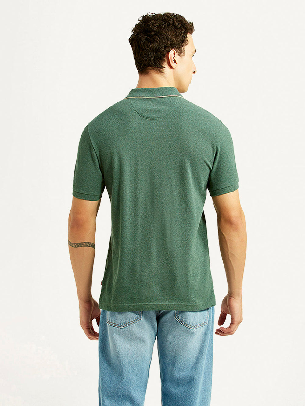 Levi's men's textured green slim fit polo t-shirt shown from the back, featuring long sleeves and a classic collar.