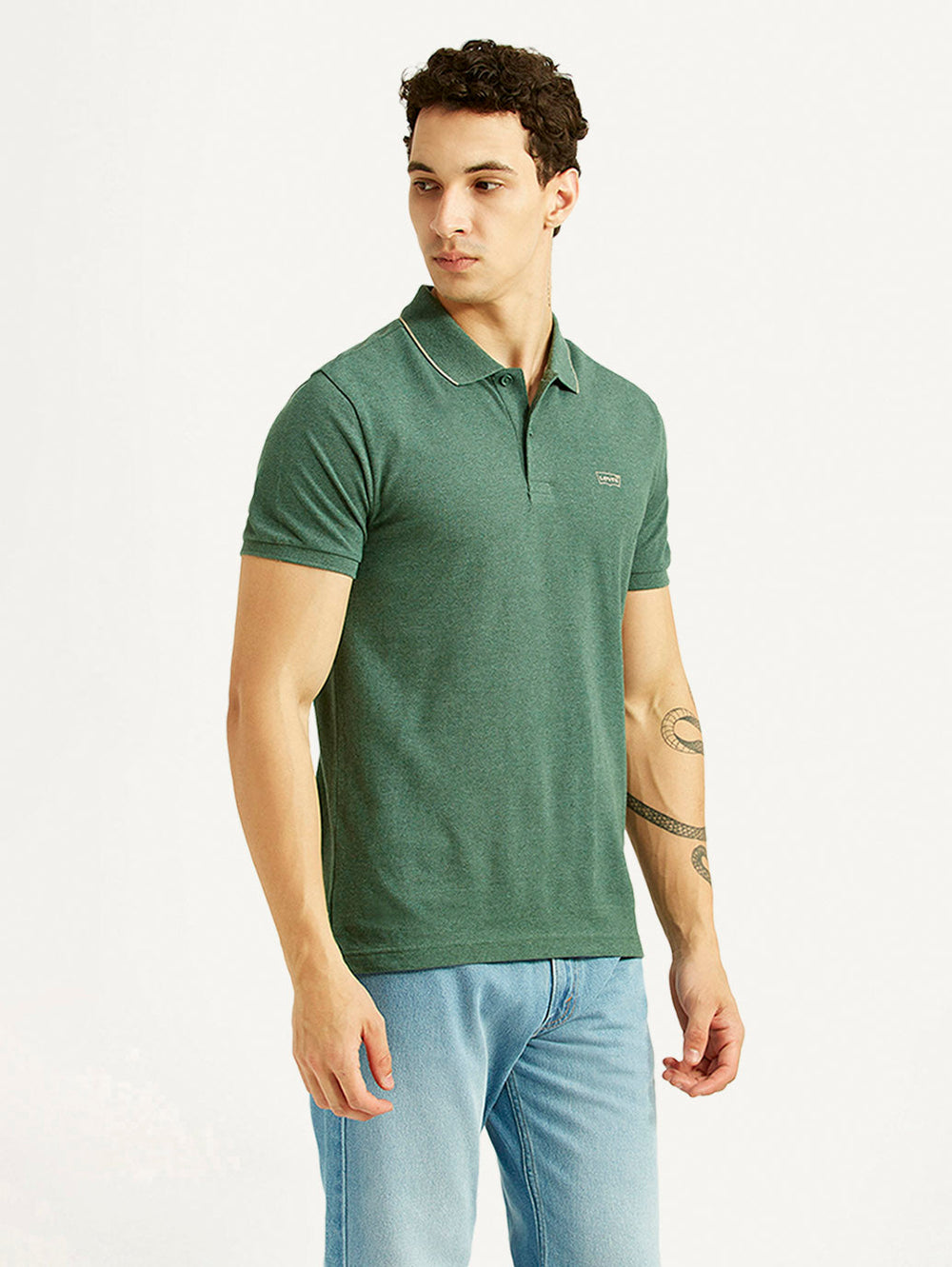 Levi's men's textured green slim fit polo T-shirt, side view showing short sleeves and classic collar detail.