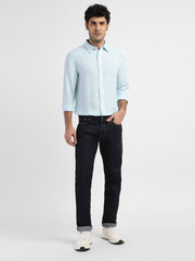 Levis men's 511 navy blue slim fit mid-rise jeans, front view showing classic five-pocket style and tapered leg fit.