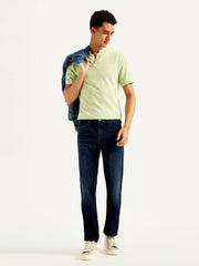 Levi's men's 511 blue slim fit mid-rise jeans, shown on a model, featuring classic five-pocket design and modern fit.