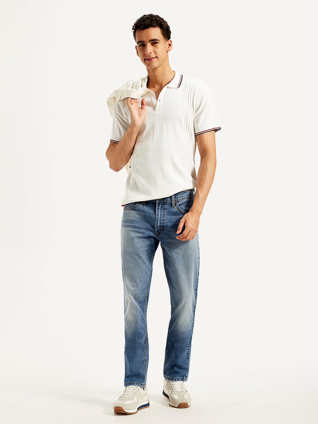 Levi's men's 511 blue slim fit mid-rise jeans displayed on a model, showcasing the classic denim style and modern fit.