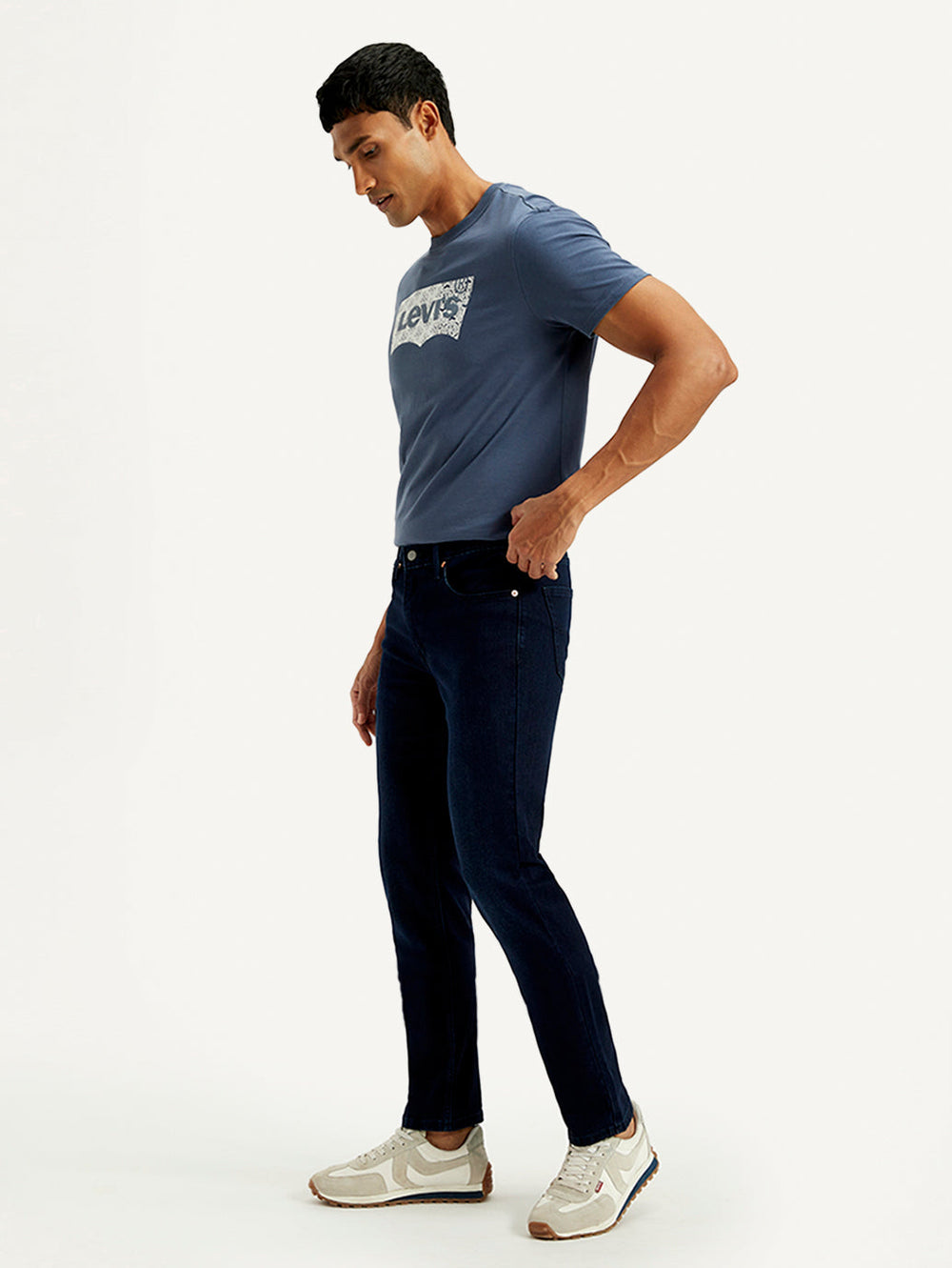 Levis men's jeans 18298-1736 shown from the side, classic fit denim pants with visible stitching and five-pocket design.