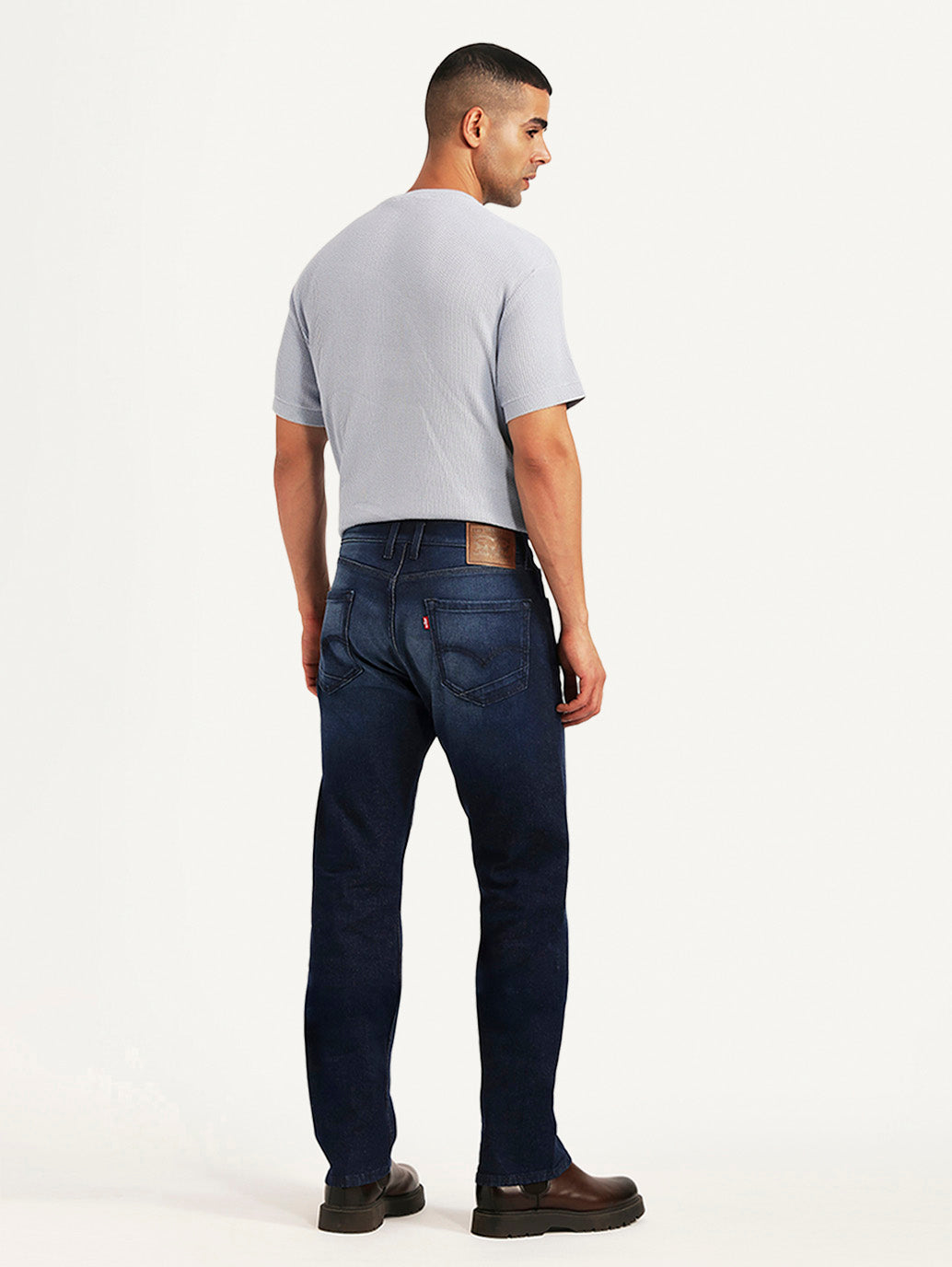 Back view of Levi's men's 511 dark blue slim fit hyper stretch jeans showing fit and stitching details.