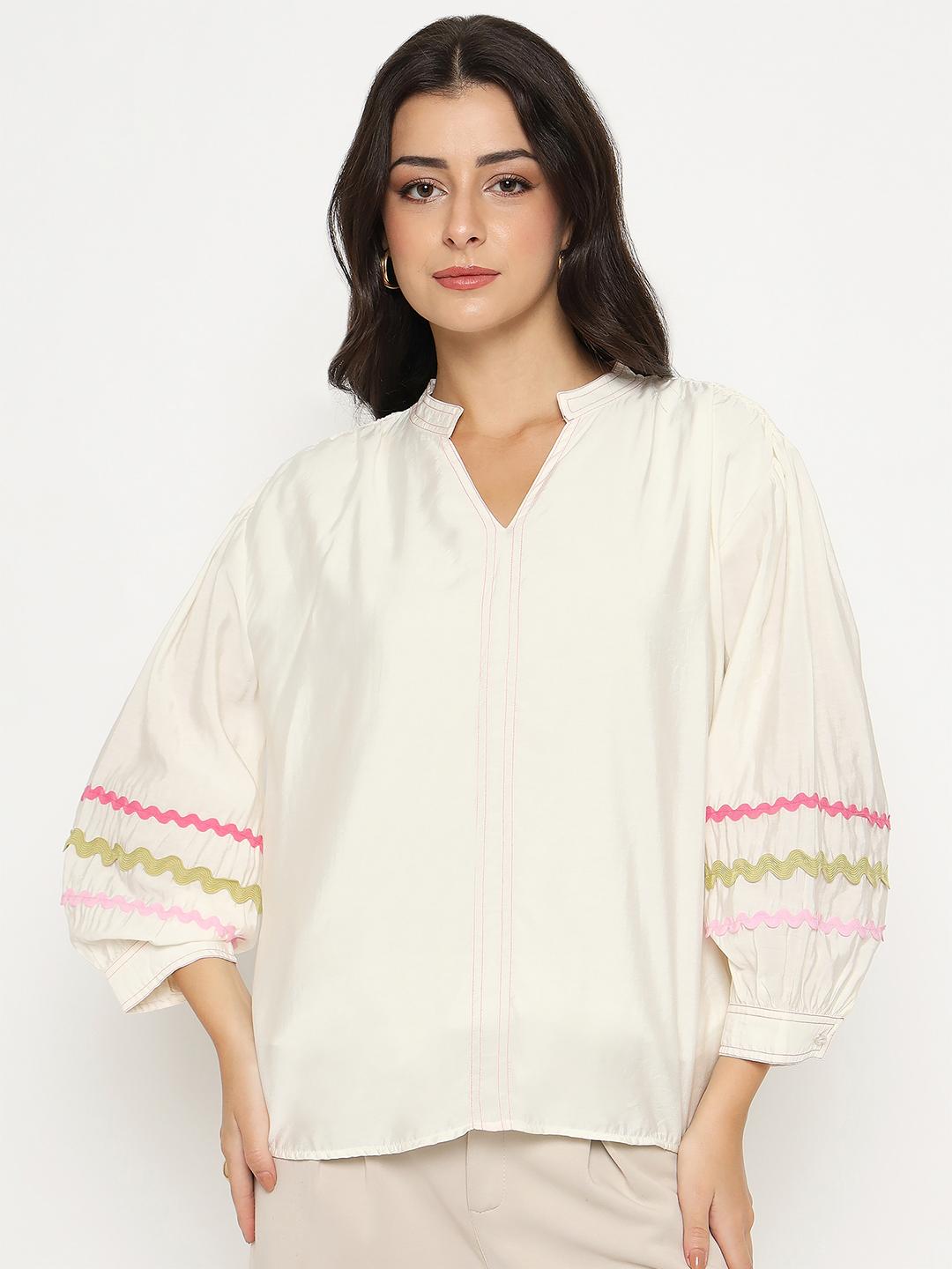 Madame ladies Western top in off-white with long sleeves, casual style, displayed on a hanger.