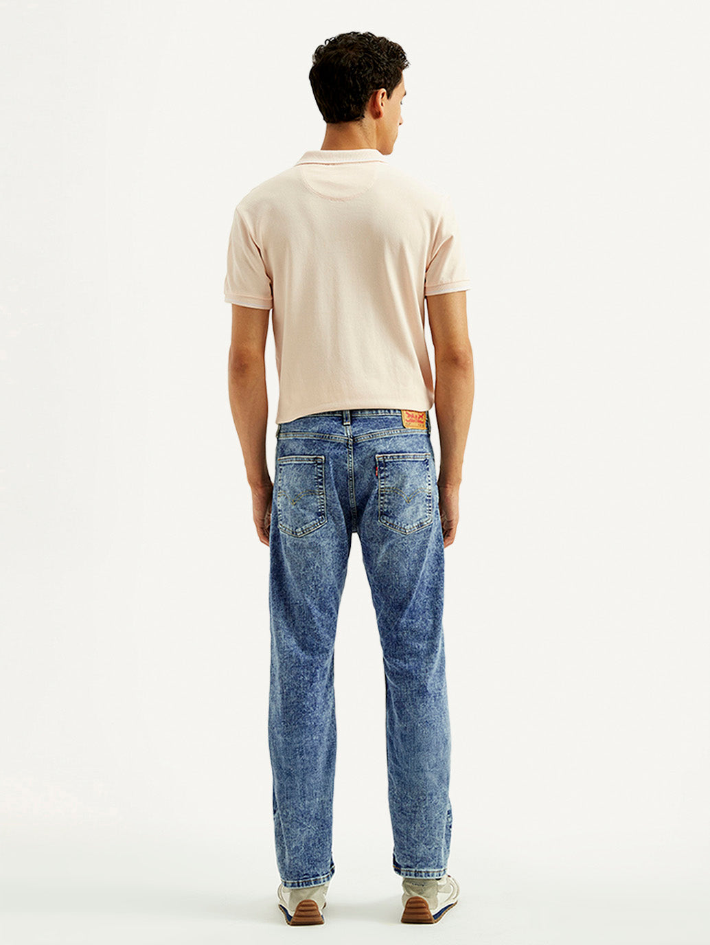 Levi's men's jeans 23677-0390 showing back view with classic denim fabric and leather patch on waistband.