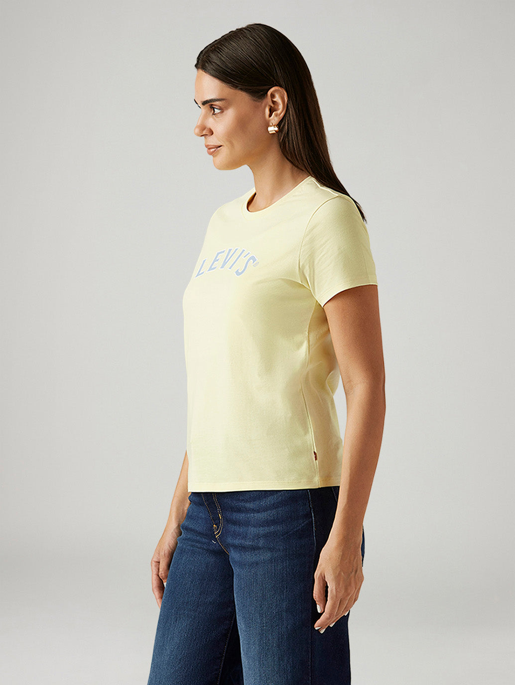 Levi's women's yellow crew neck T-shirt with brand logo, side view, casual Western-style top for women.